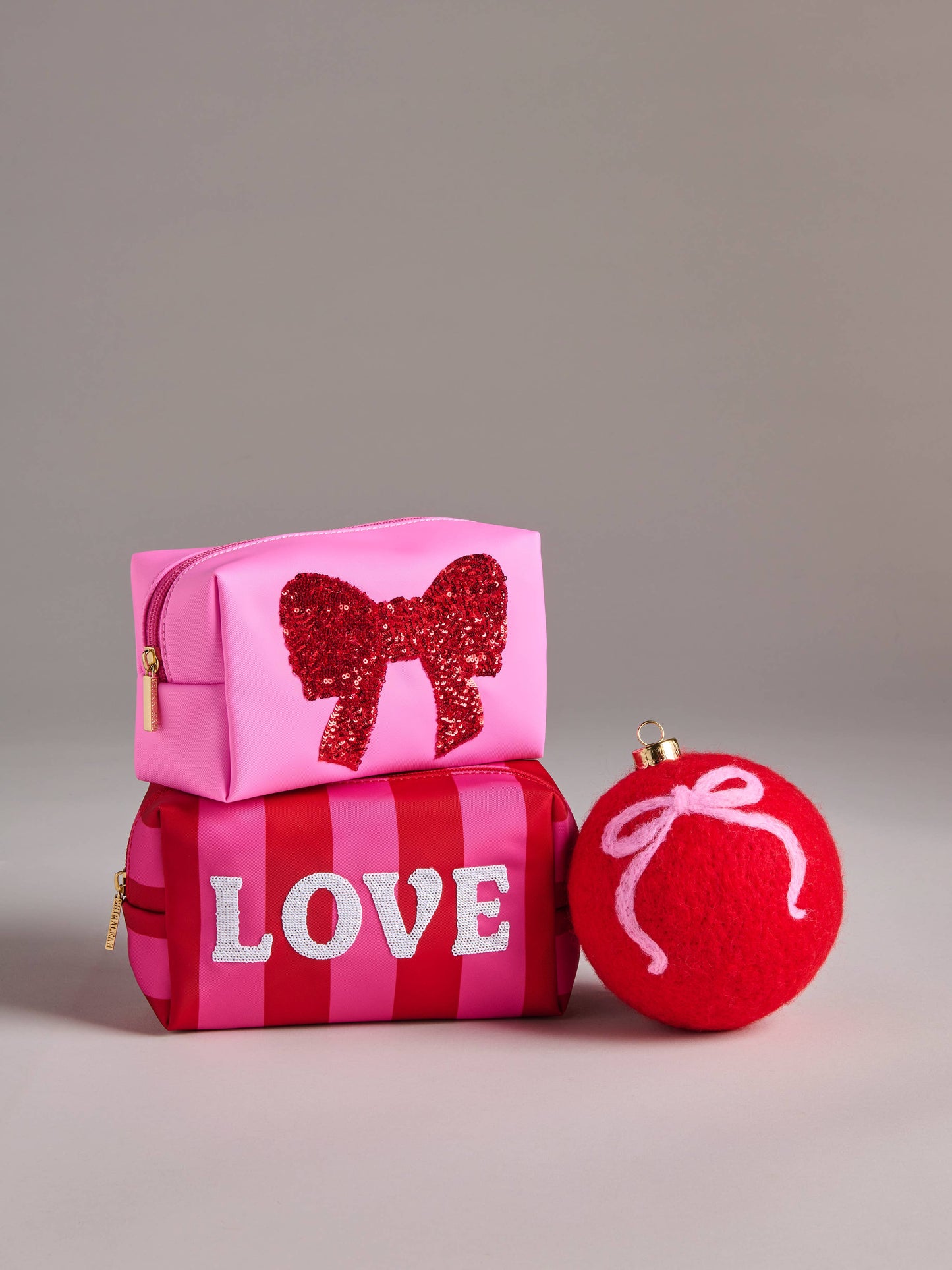 CARA SEQUIN BOW ZIP POUCH,PINK