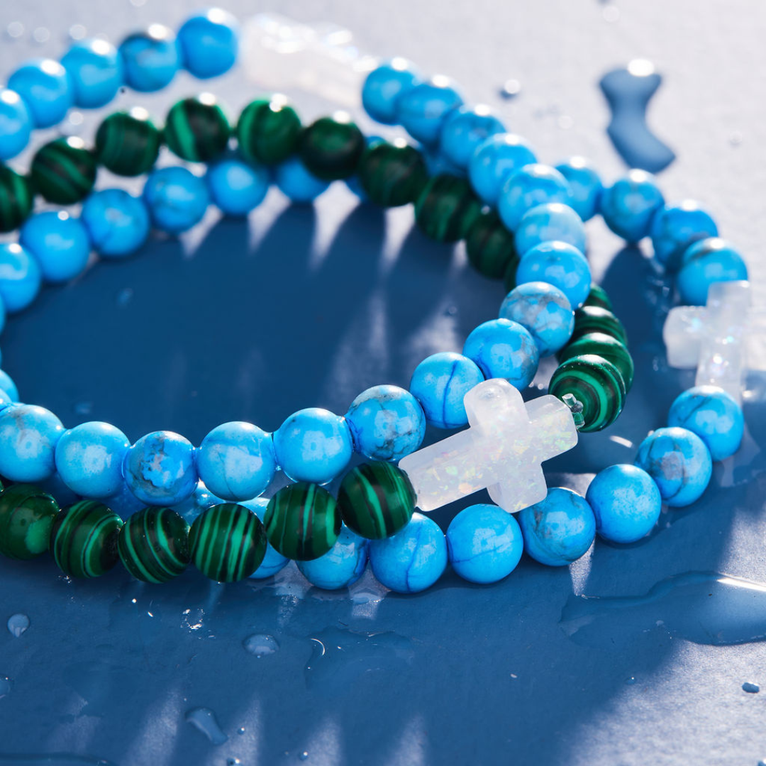 HOLY WATER CROSS BRACELET IN BLUE HOWLITE