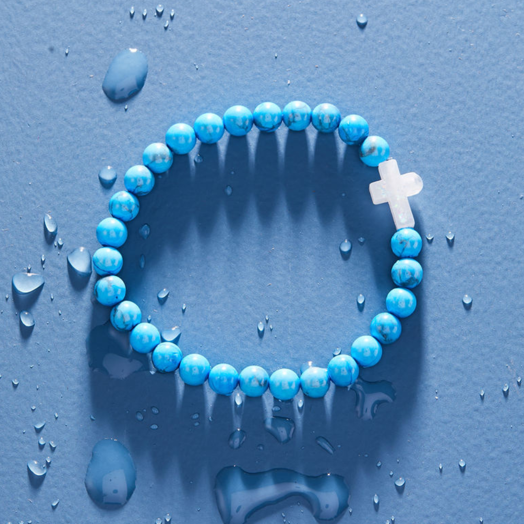 HOLY WATER CROSS BRACELET IN BLUE HOWLITE