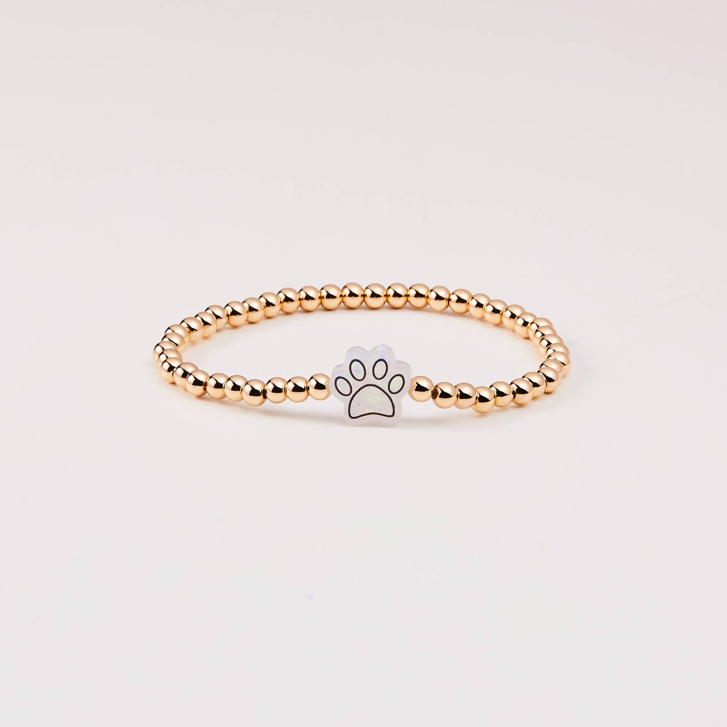 HOLY WATER PAWPRINT BRACELET IN GOLD